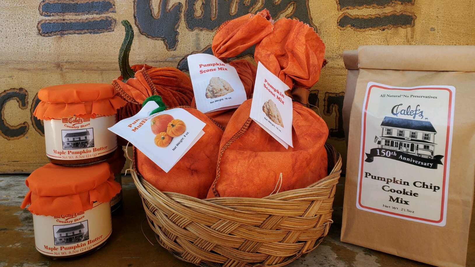 Calef's Maple Pumpkin Butter jars, a basket of Pumpkin Muffin and Scone Mix, and Pumpkin Chip Cookie Mix