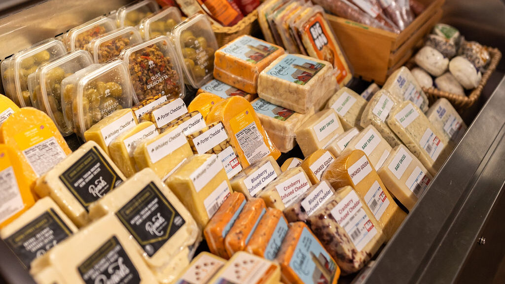 Calef's cheese counter with an assortment of gourmet cheese