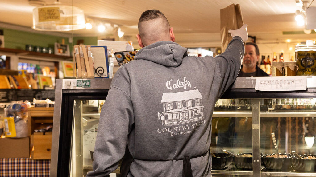 Calef's deli employee serving a local customer