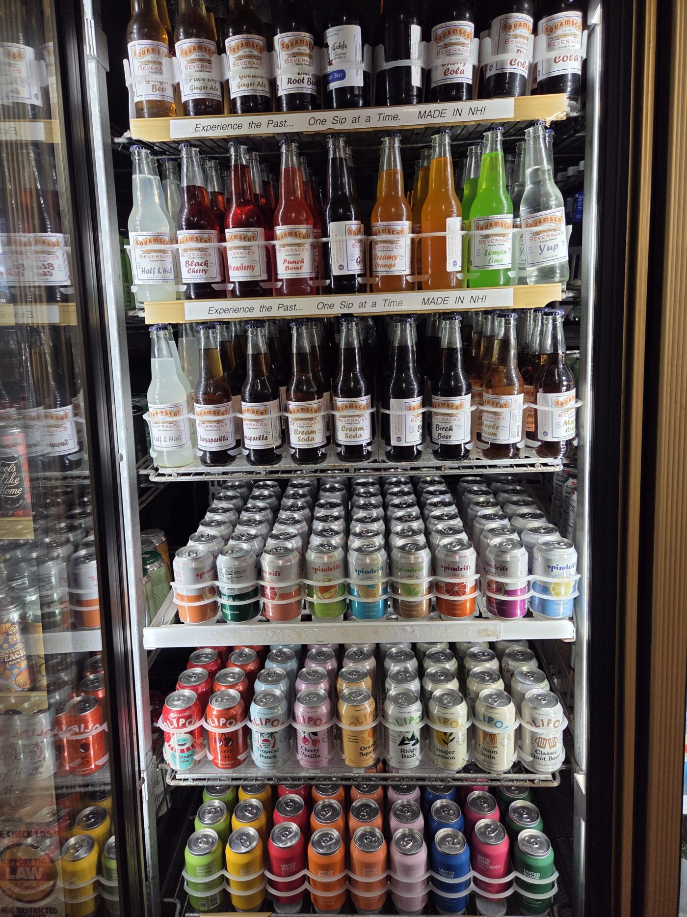 Calef's soda case with old fashioned sodas and seltzer water